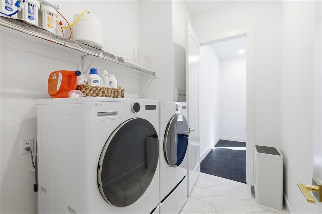 16194 Inca Dove Court Frisco, TX 75035 - Photo 25 of 40 Laundry Room with storage above, access door to Primary walk-in closet and door to Exercise Room.