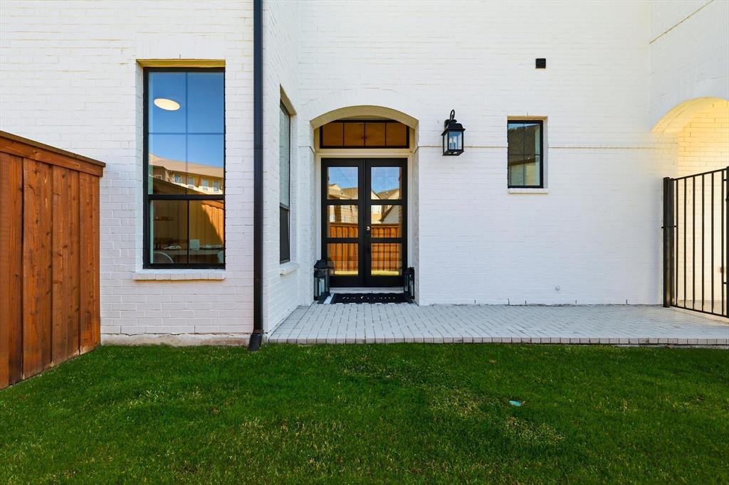 16194 Inca Dove Court Frisco, TX 75035 - Photo 3 of 40 Courtyard entrance to property with modern double doors and painted brick exterior