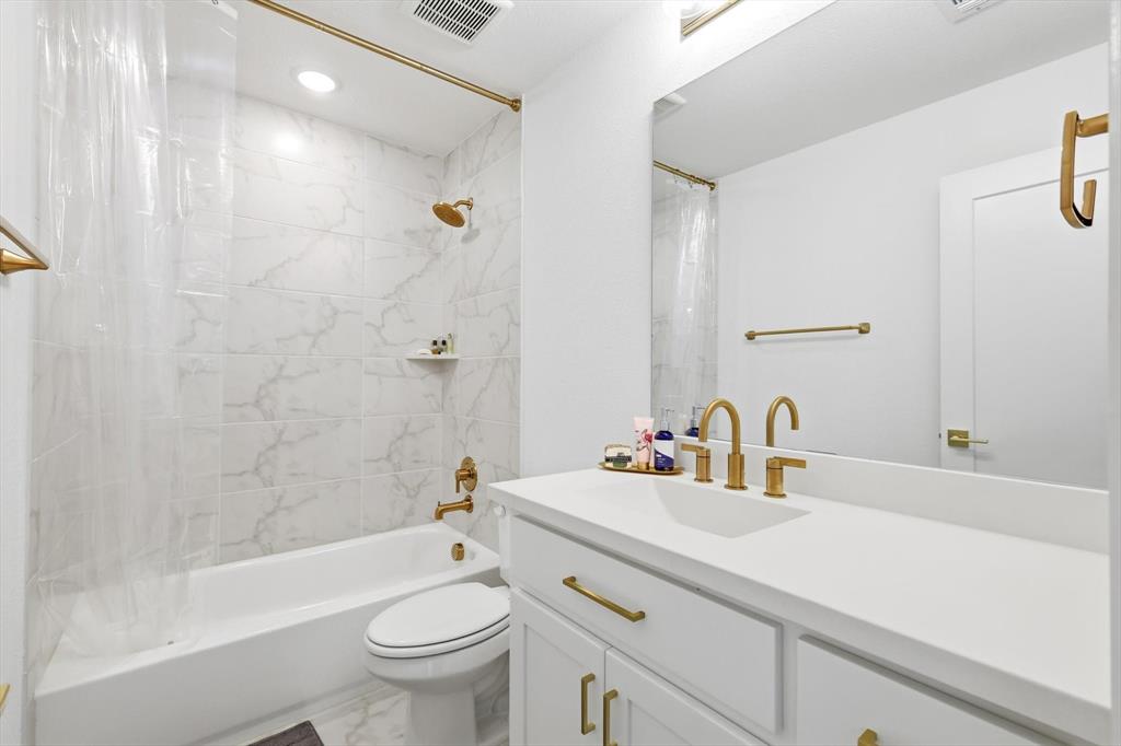 16194 Inca Dove Court Frisco, TX 75035 - Photo 31 of 40 Bathroom 3 featuring shower / tub combo, vanity, and gold hardware.