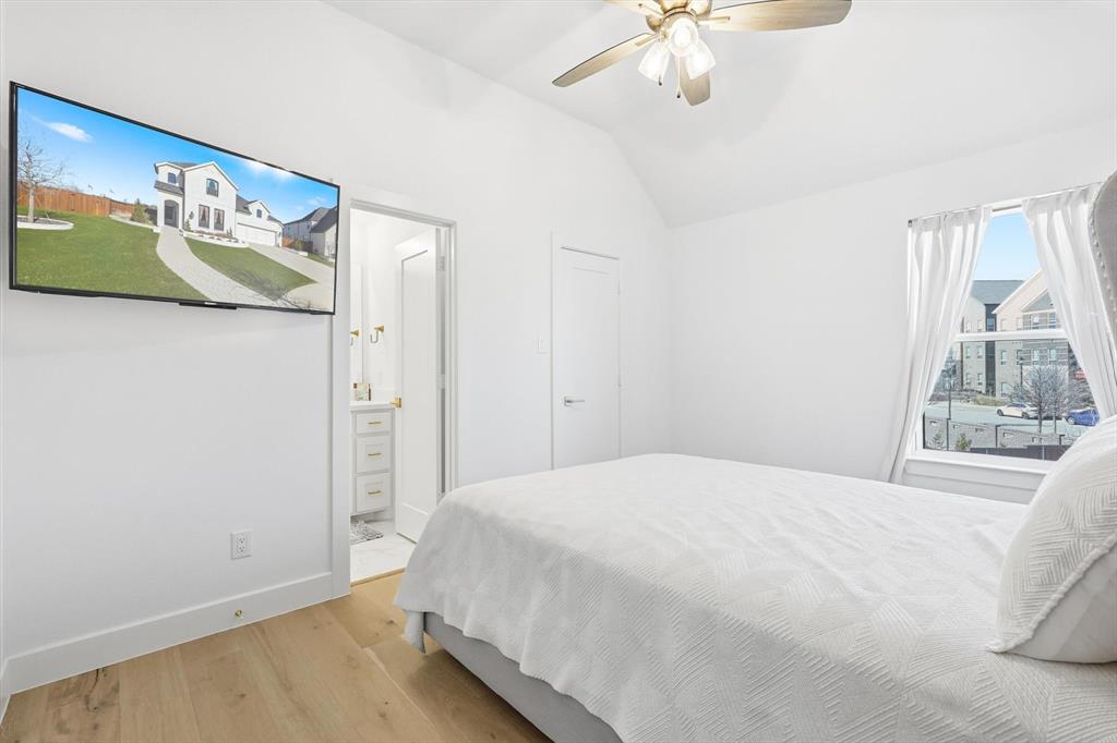 16194 Inca Dove Court Frisco, TX 75035 - Photo 32 of 40 Bedroom 4 adjacent to Game Room with upgraded wood floors, tall ceiling and En Suite bath.