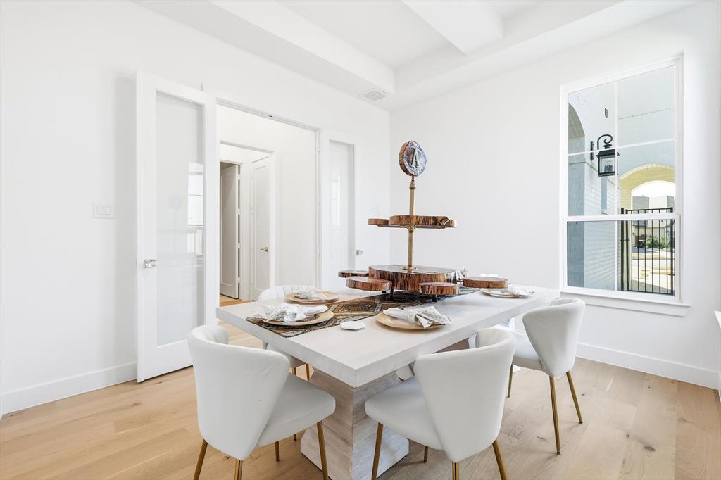 16194 Inca Dove Court Frisco, TX 75035 - Photo 6 of 40 Formal Dining Room featuring french doors and upgraded wood flooring. Space can be used as a home office for maximum flexibility.