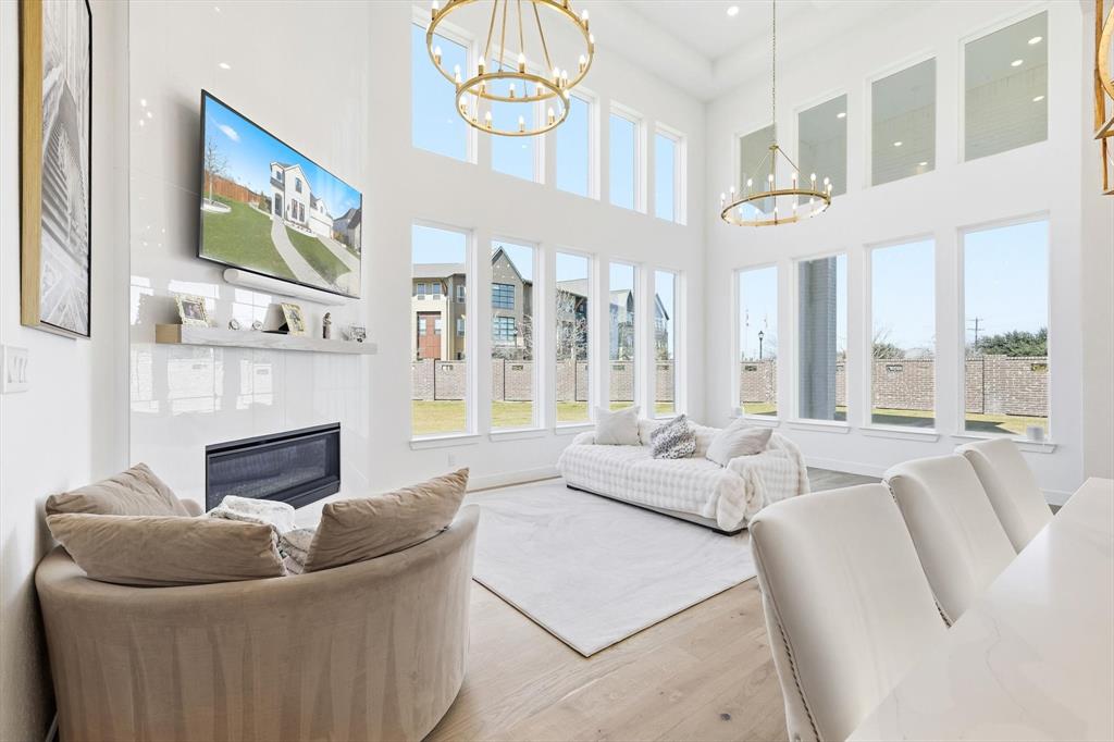 16194 Inca Dove Court Frisco, TX 75035 - Photo 10 of 40 Family Room with dramatic windows allowing for abundant natural lighting.