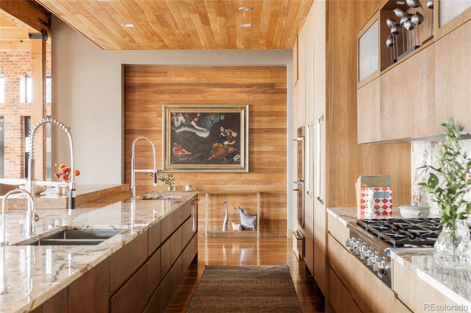 1500 Wynkoop Street, Unit PH1 Denver, CO 80202 - Photo 12 of 50 a kitchen with stainless steel appliances granite countertop a stove and a sink