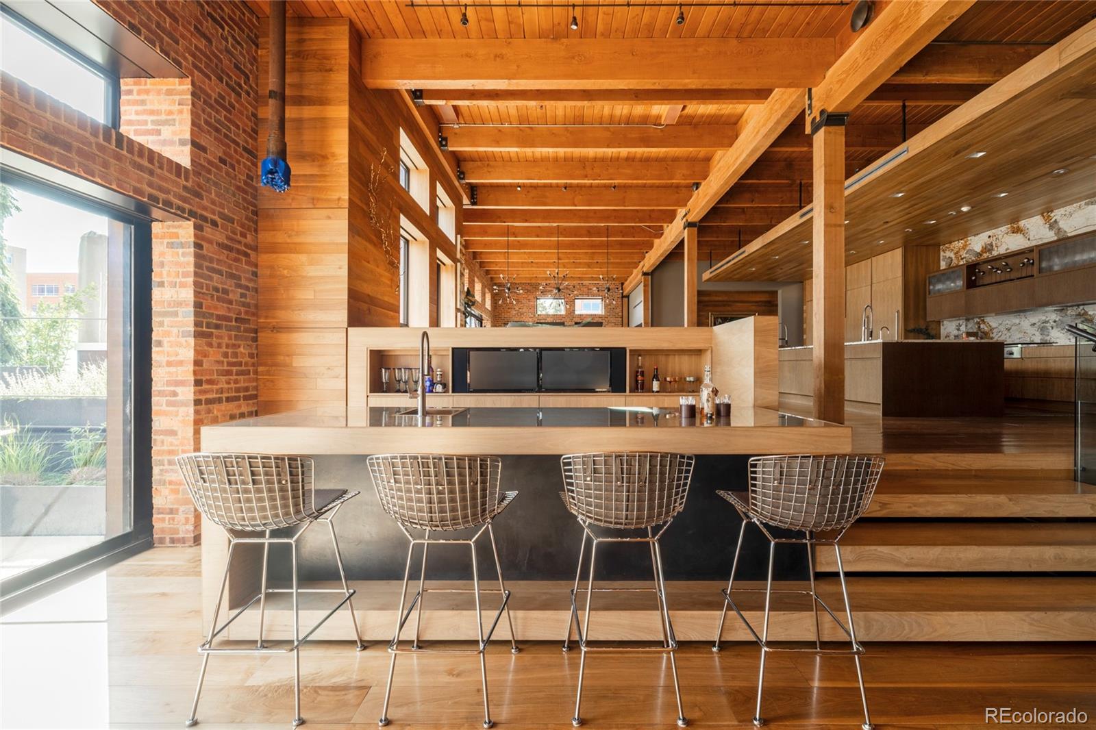 1500 Wynkoop Street, Unit PH1 Denver, CO 80202 - Photo 17 of 50 a dining room with furniture and wooden floor