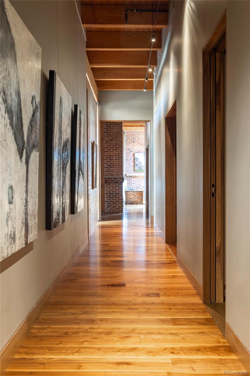 1500 Wynkoop Street, Unit PH1 Denver, CO 80202 - Photo 34 of 50 a view of a hallway with wooden floor and a living room