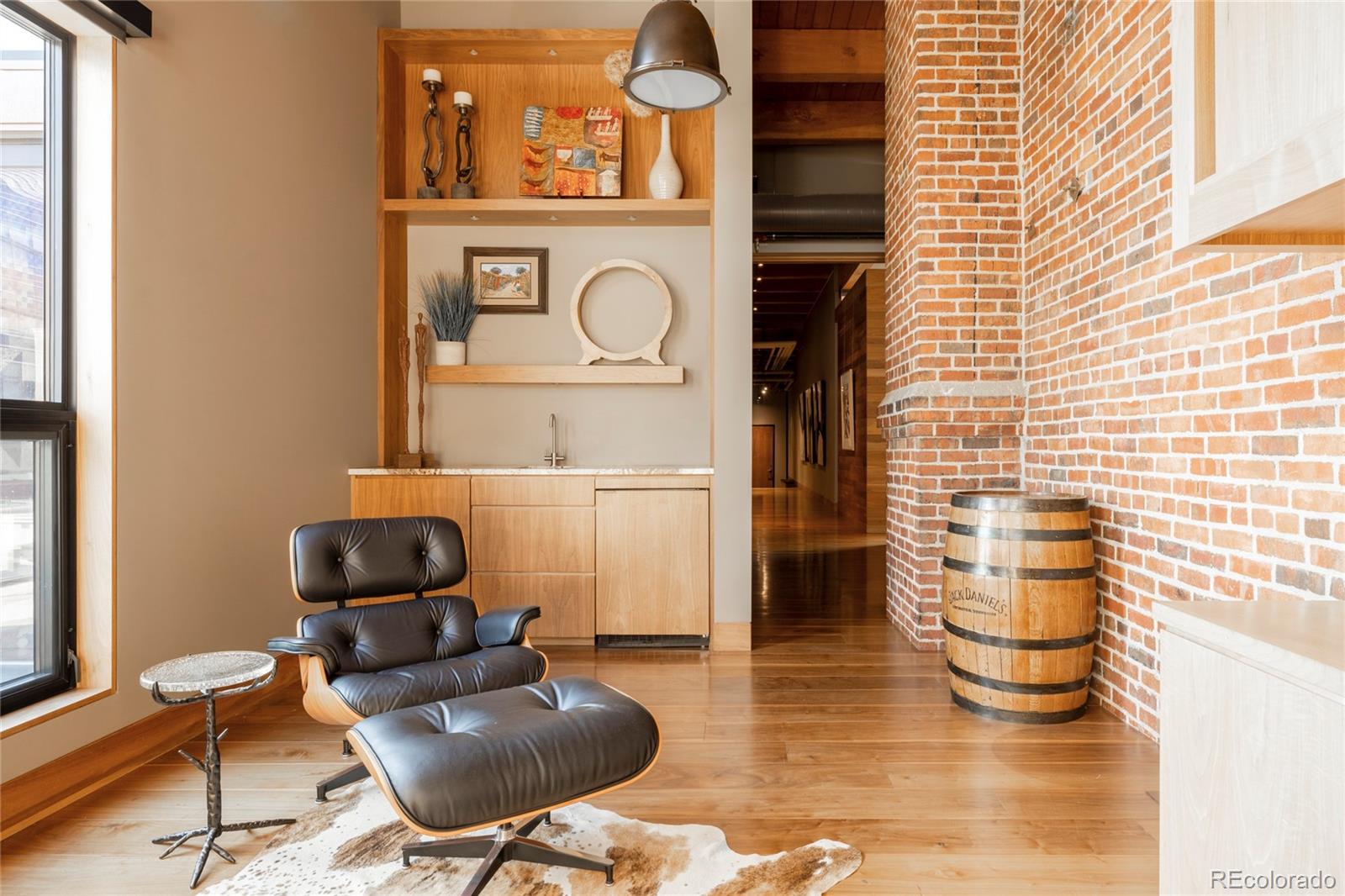 1500 Wynkoop Street, Unit PH1 Denver, CO 80202 - Photo 36 of 50 a living room with furniture and a potted plant