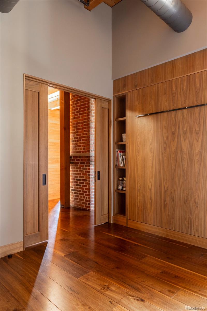 1500 Wynkoop Street, Unit PH1 Denver, CO 80202 - Photo 39 of 50 an empty room with wooden floor and windows