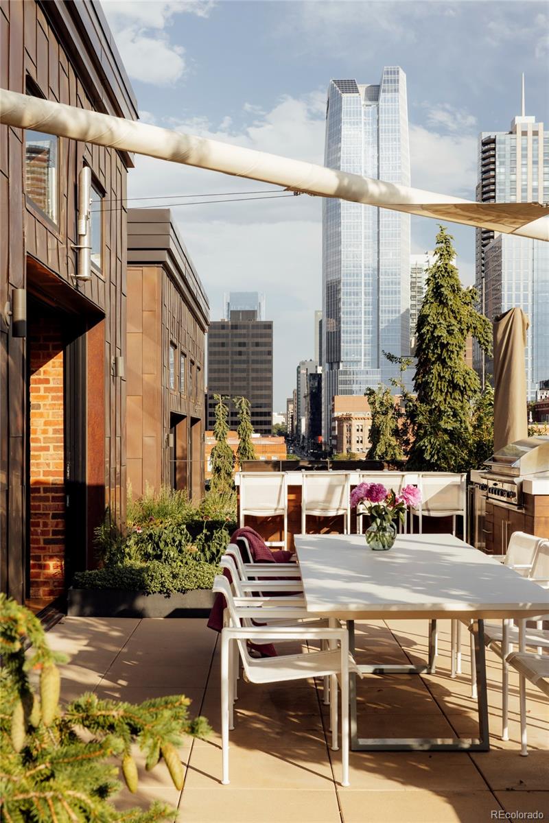 1500 Wynkoop Street, Unit PH1 Denver, CO 80202 - Photo 4 of 50 a view of a patio with couches table and chairs and potted plants