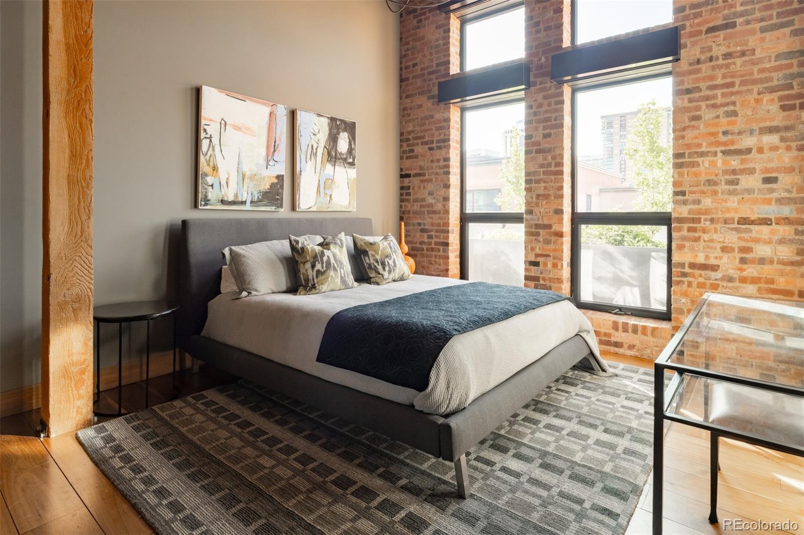 1500 Wynkoop Street, Unit PH1 Denver, CO 80202 - Photo 44 of 50 a bedroom with a bed next to a window