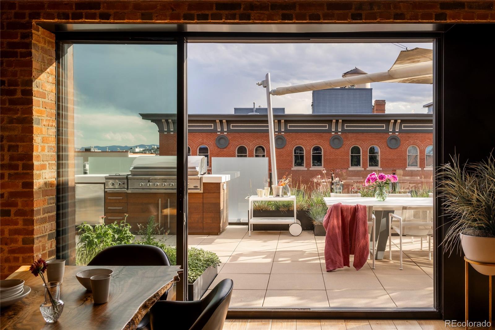 1500 Wynkoop Street, Unit PH1 Denver, CO 80202 - Photo 5 of 50 a balcony with furniture and a potted plant