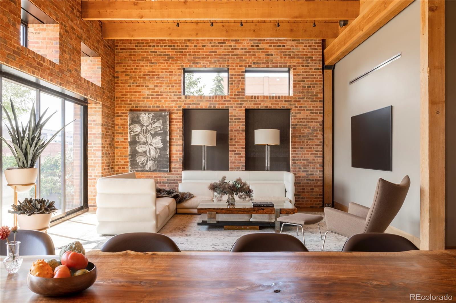 1500 Wynkoop Street, Unit PH1 Denver, CO 80202 - Photo 9 of 50 a living room with furniture and large windows
