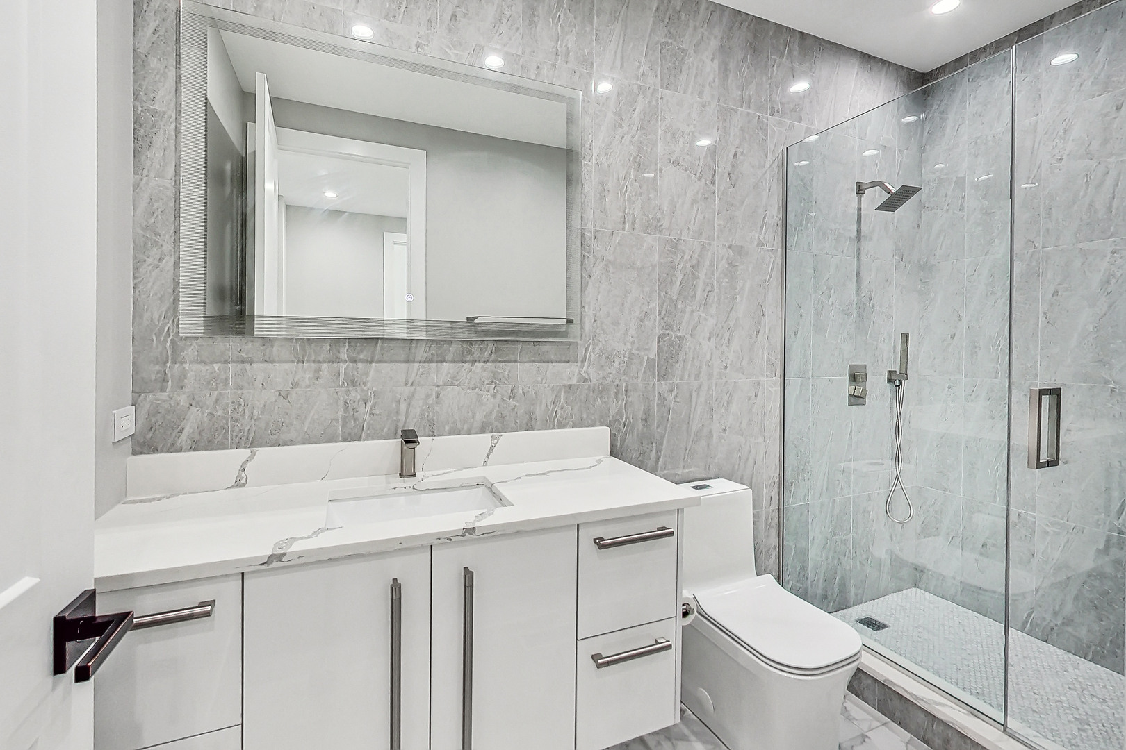 1331 Pfingsten Road Northbrook, IL 60062 - Photo 16 of 29 a bathroom with a sink toilet and shower