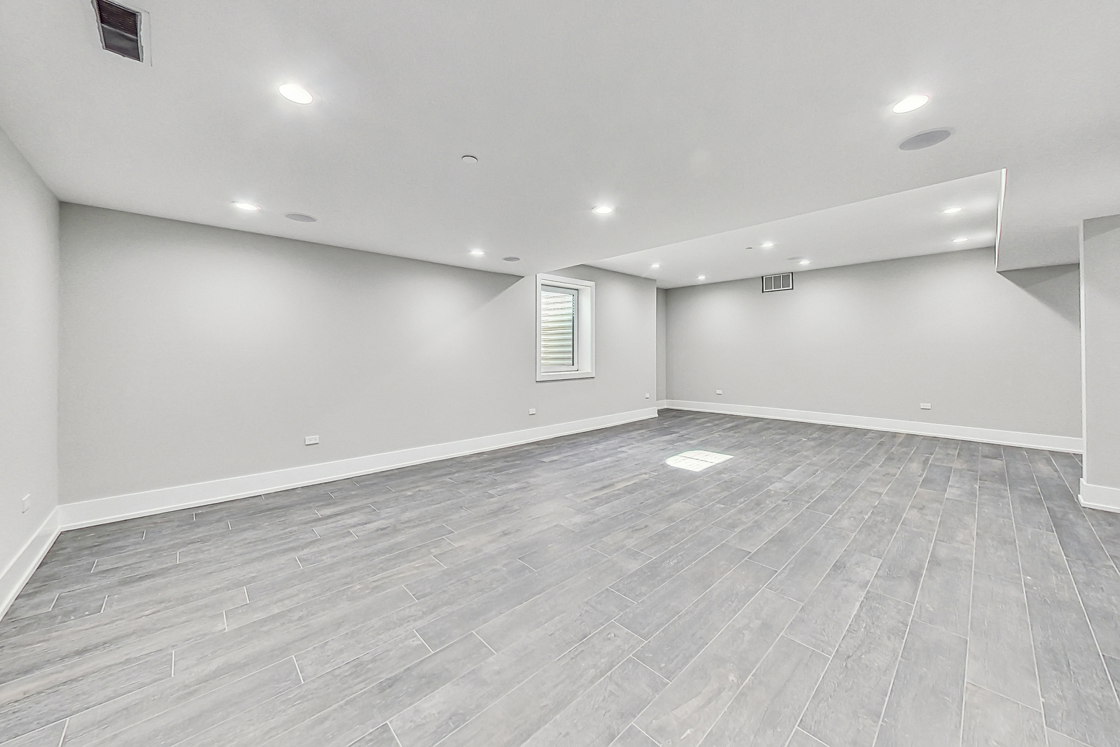 1331 Pfingsten Road Northbrook, IL 60062 - Photo 21 of 29 an empty room with wooden floor and windows