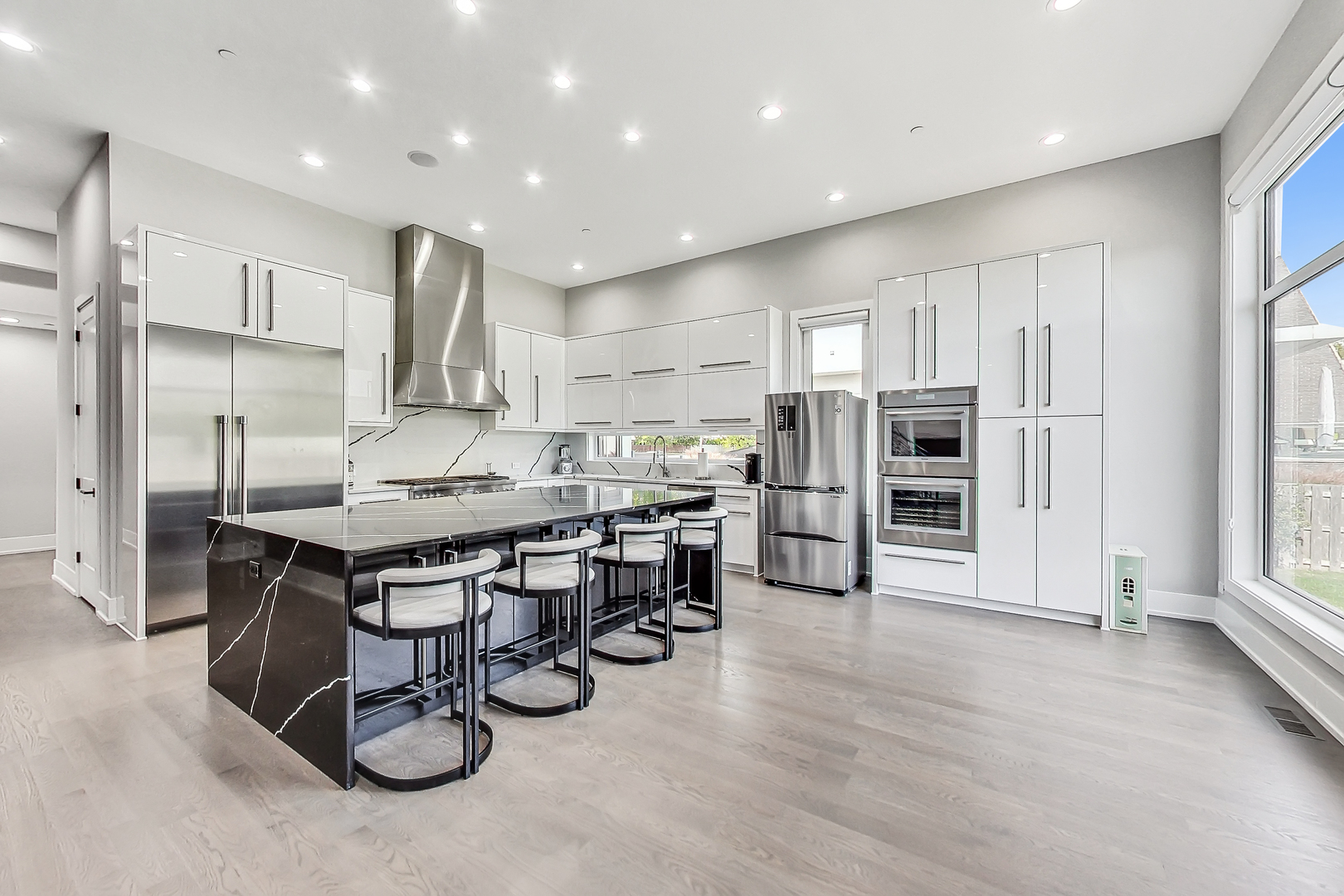 1331 Pfingsten Road Northbrook, IL 60062 - Photo 7 of 29 a kitchen with stainless steel appliances a refrigerator a sink dishwasher and a stove top oven