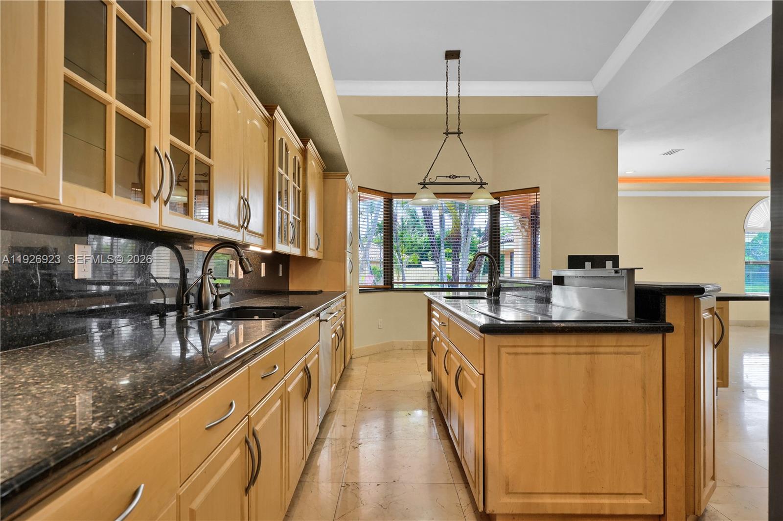 3001 Southwest 132nd Avenue Miami, FL 33175 - Photo 12 of 54 a kitchen with stainless steel appliances granite countertop sink stove and cabinets