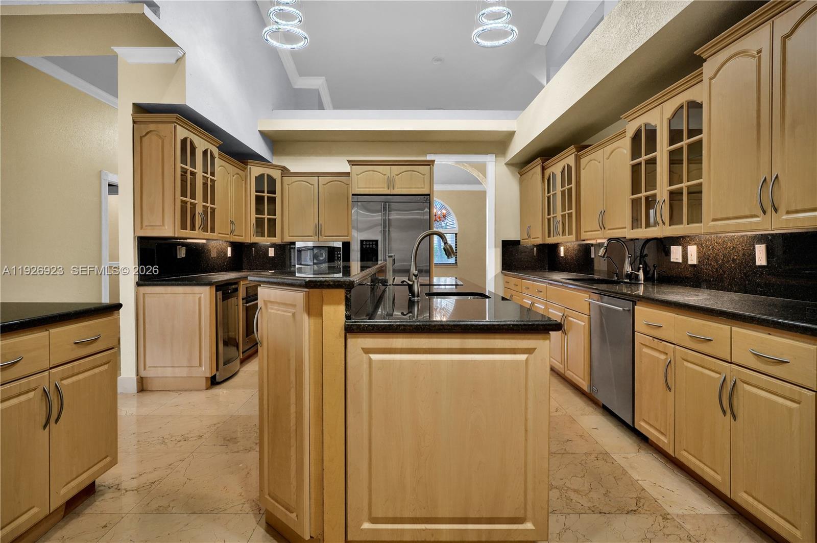 3001 Southwest 132nd Avenue Miami, FL 33175 - Photo 14 of 54 a kitchen with stainless steel appliances granite countertop a stove a sink and a refrigerator