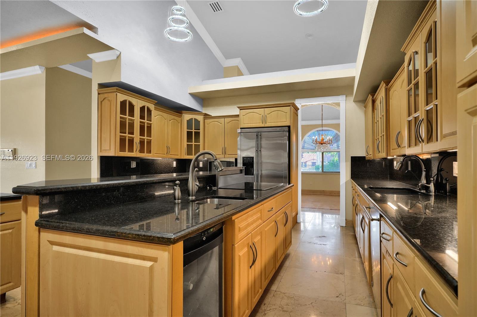 3001 Southwest 132nd Avenue Miami, FL 33175 - Photo 15 of 54 a kitchen with stainless steel appliances granite countertop a sink stove and refrigerator