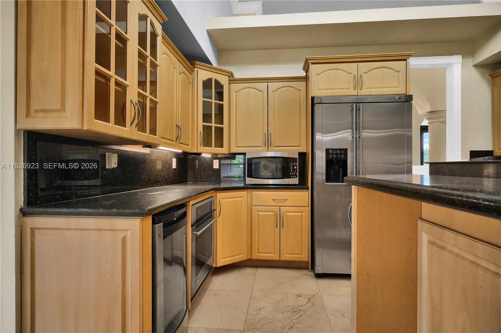3001 Southwest 132nd Avenue Miami, FL 33175 - Photo 16 of 54 a kitchen with stainless steel appliances a refrigerator and a stove