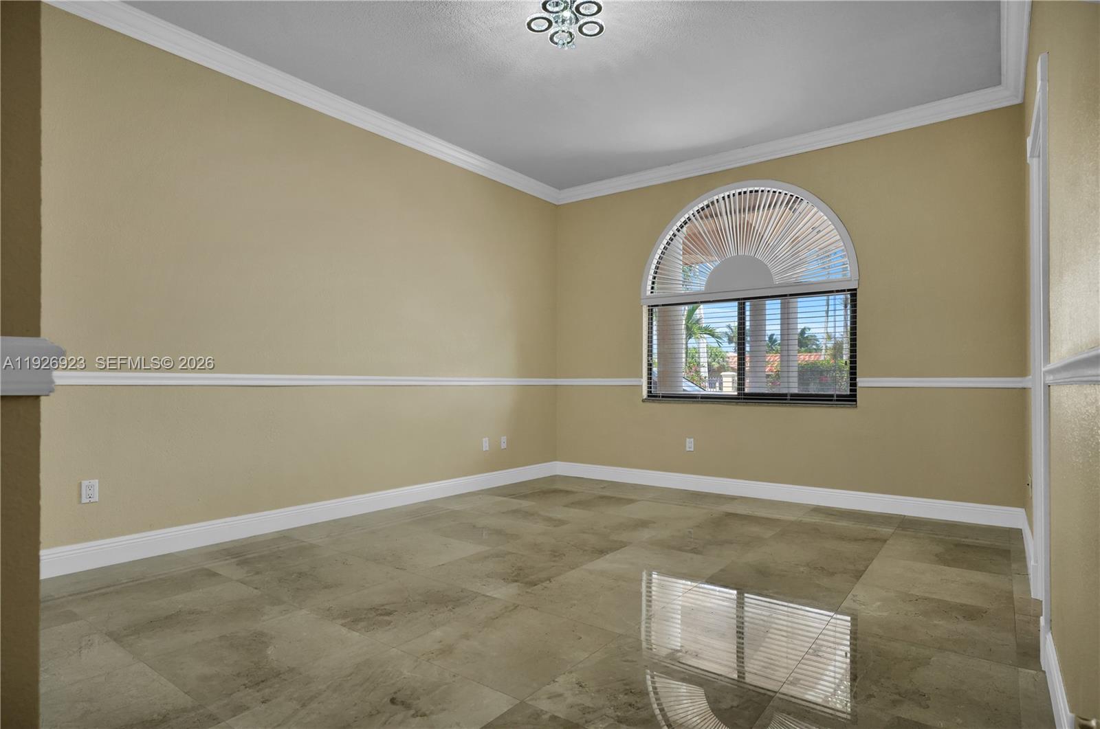 3001 Southwest 132nd Avenue Miami, FL 33175 - Photo 23 of 54 an empty room with windows and chandelier