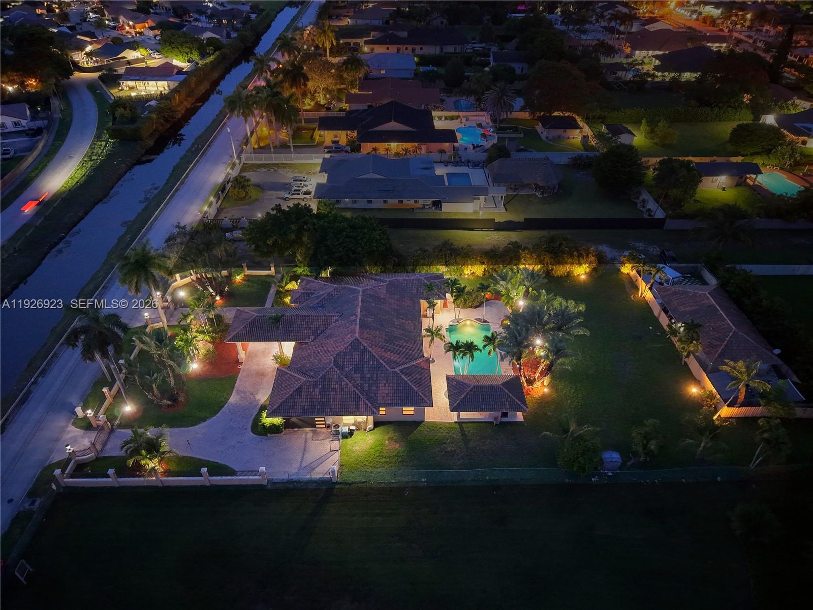 3001 Southwest 132nd Avenue Miami, FL 33175 - Photo 4 of 54 an aerial view of a house swimming pool outdoor seating and outdoor kitchen