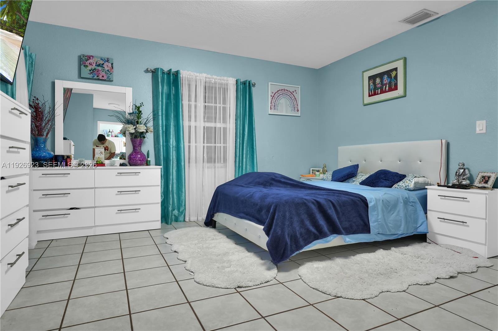 3001 Southwest 132nd Avenue Miami, FL 33175 - Photo 48 of 54 a bedroom with a large bed and a dresser