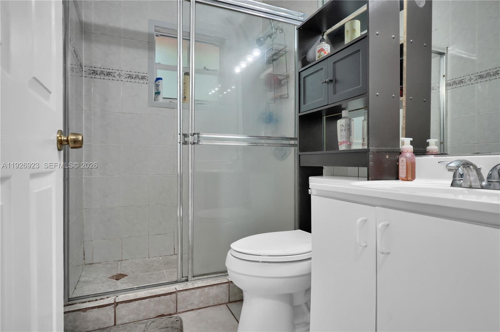 3001 Southwest 132nd Avenue Miami, FL 33175 - Photo 51 of 54 a bathroom with a shower a toilet and sink