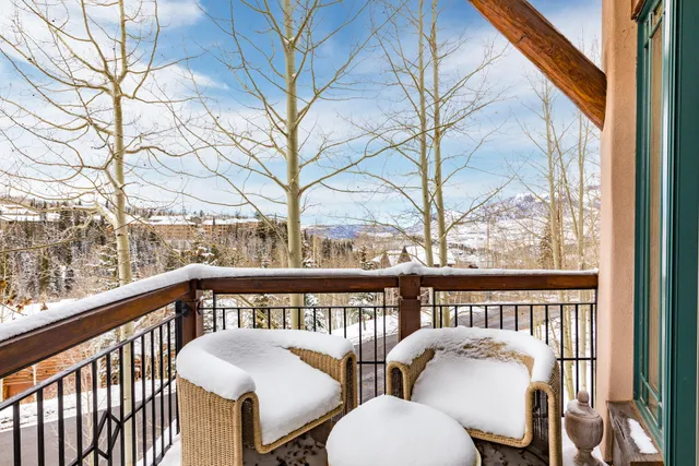 a view of a chair and table in the balcony
