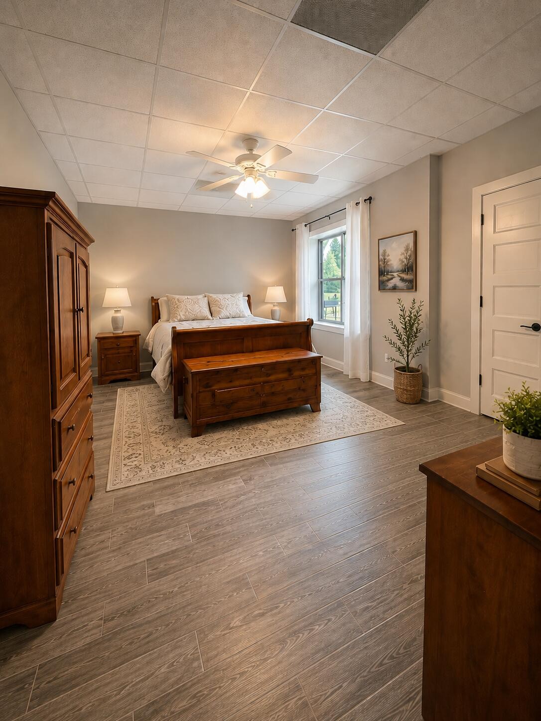 3870 Head Road Adams, TN 37010 - Photo 25 of 33 a spacious bedroom with a bed and wooden floor