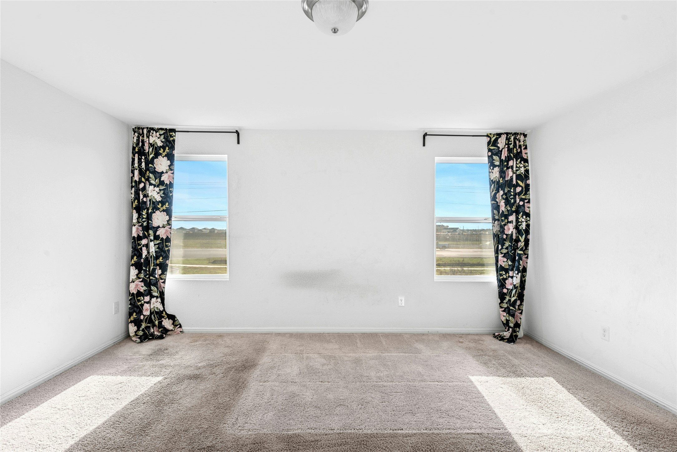 566 Delta Crest Maxwell, TX 78656 - Photo 13 of 27 Carpeted spare room featuring baseboards