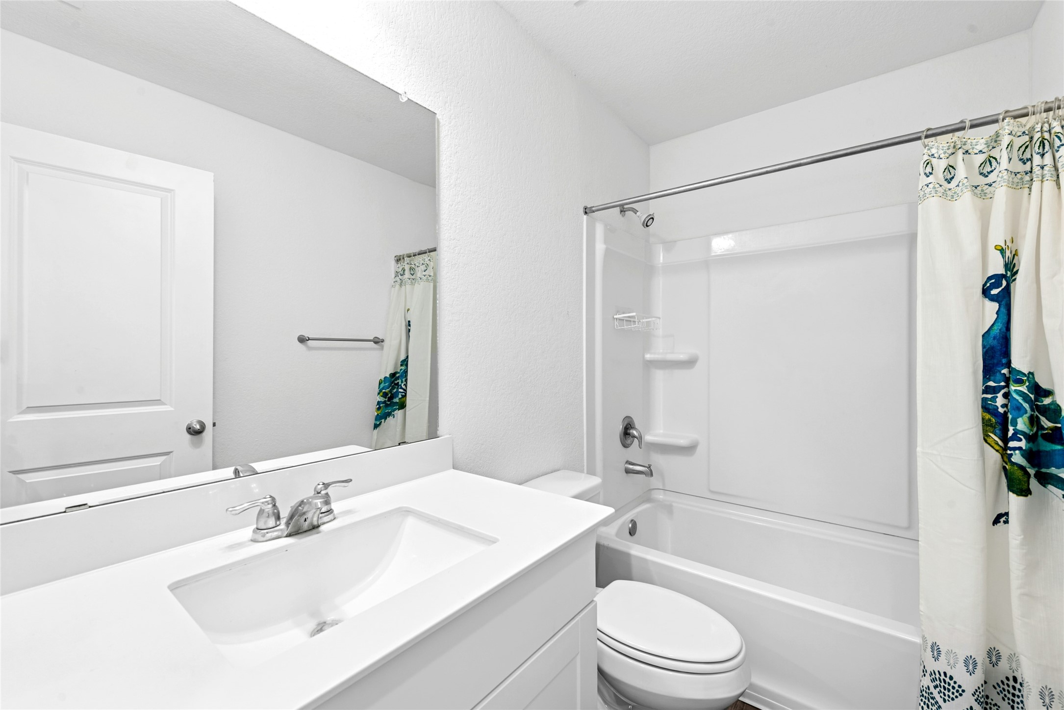 566 Delta Crest Maxwell, TX 78656 - Photo 17 of 27 Full bathroom featuring shower / bath combo with shower curtain and vanity
