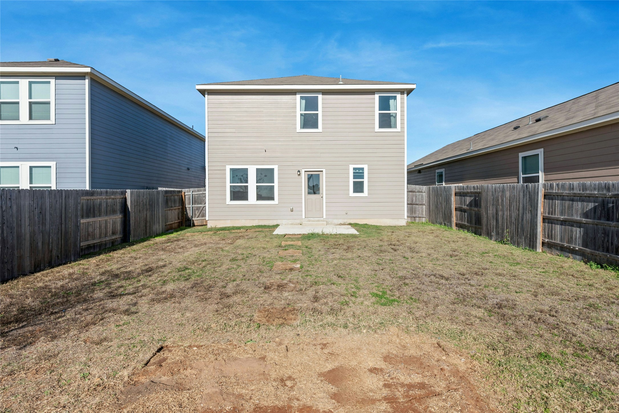 566 Delta Crest Maxwell, TX 78656 - Photo 22 of 27 Back of property with a patio area and a fenced backyard