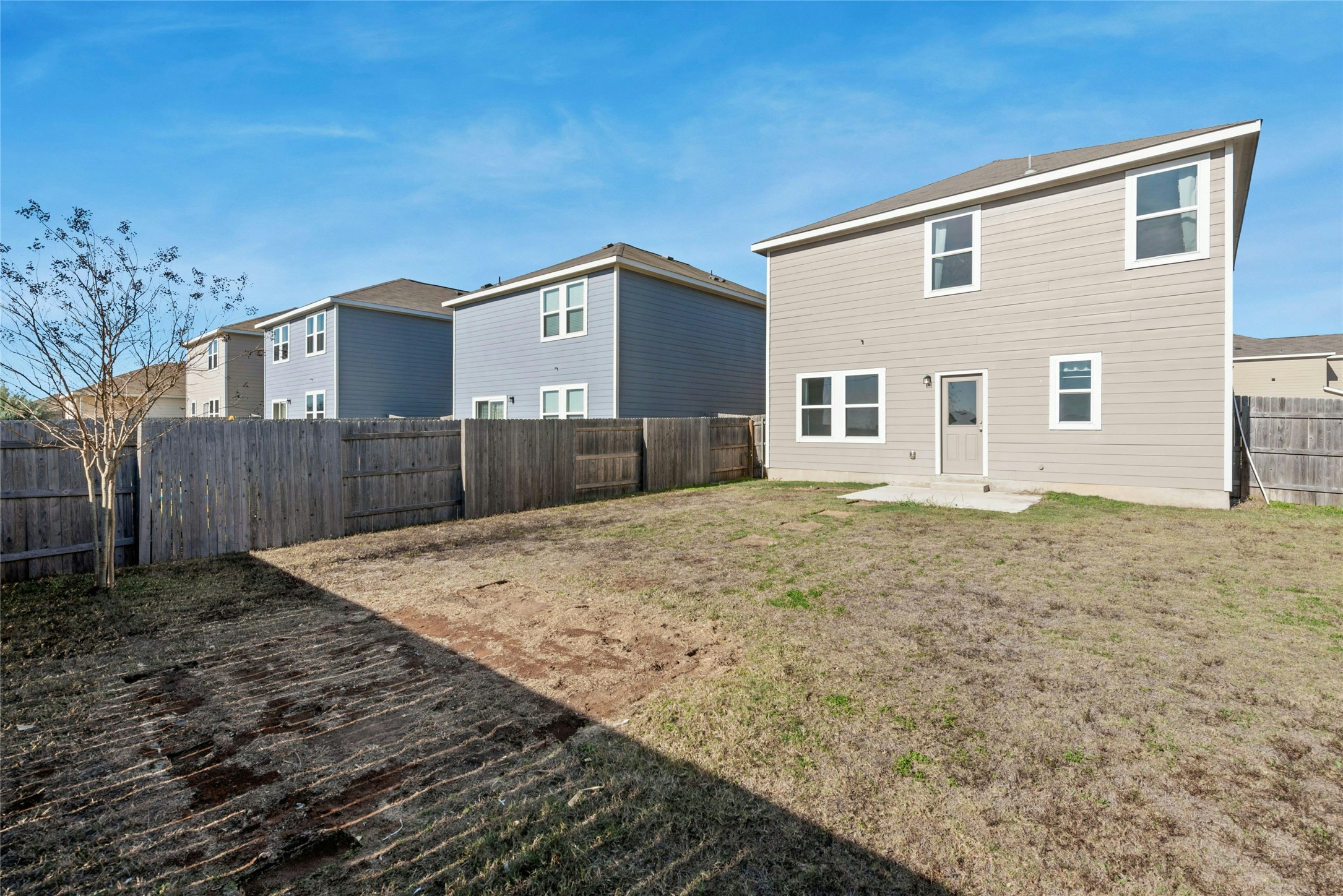 566 Delta Crest Maxwell, TX 78656 - Photo 23 of 27 Rear view of house featuring a patio area and a fenced backyard
