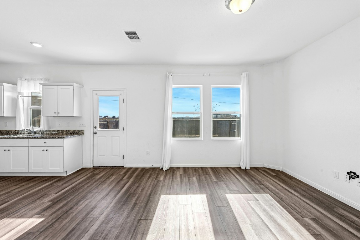 566 Delta Crest Maxwell, TX 78656 - Photo 4 of 27 a view of a kitchen with wooden floor and a sink