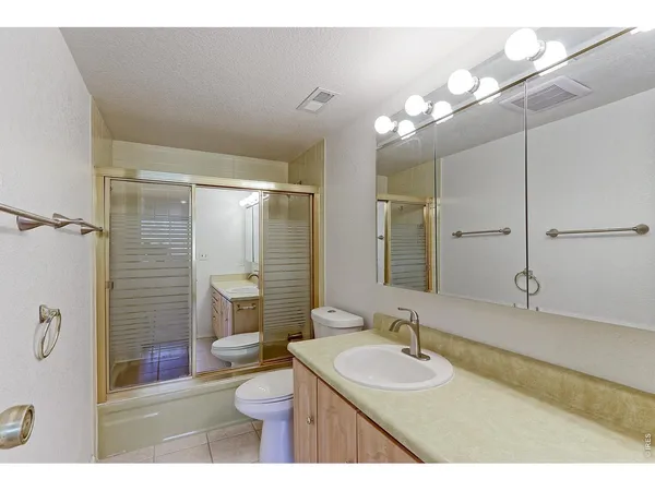 a bathroom with a sink and a shower