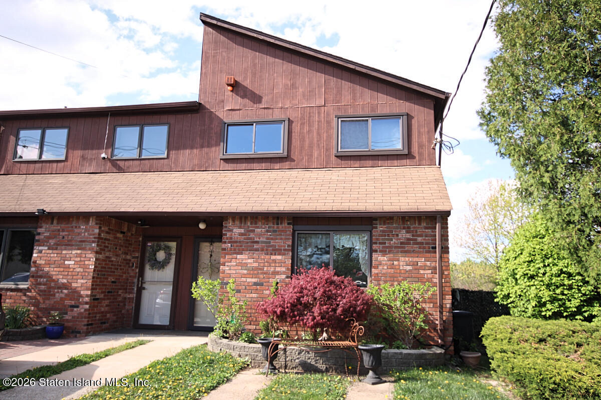 951 West Fingerboard Road Staten Island, NY 10304 - Photo 26 of 29 a front view of a house with garden