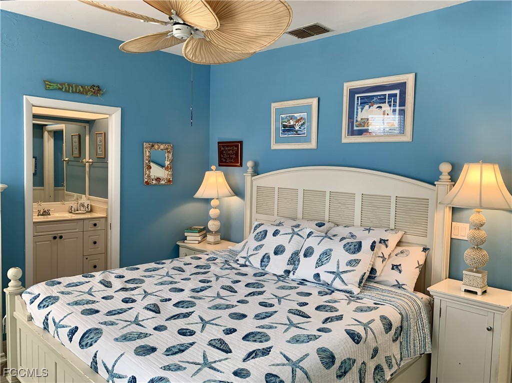 503 Useppa Useppa Island Bokeelia, FL 33922 - Photo 27 of 50 a bedroom with a bed and a cabinets