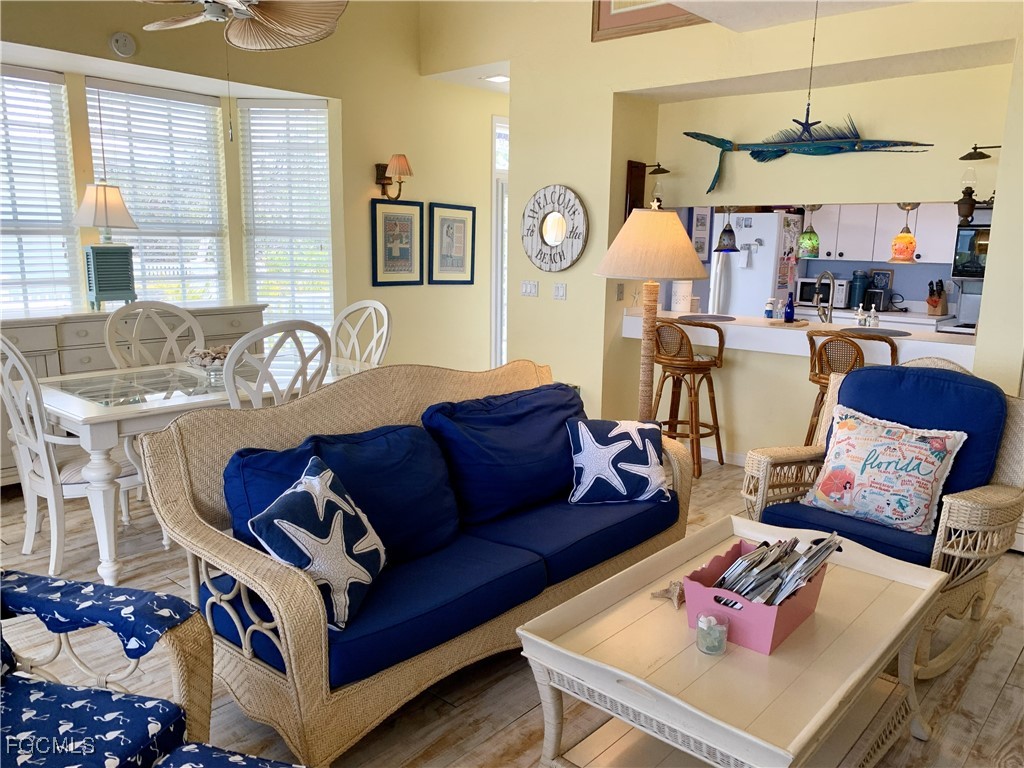 503 Useppa Useppa Island Bokeelia, FL 33922 - Photo 33 of 50 a living room with furniture fireplace and a window