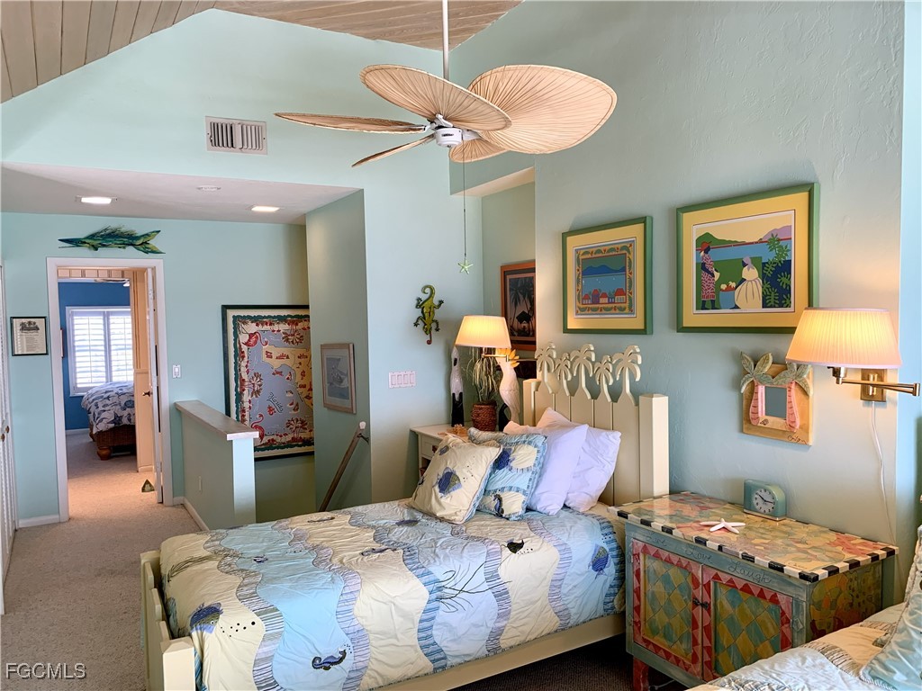 503 Useppa Useppa Island Bokeelia, FL 33922 - Photo 40 of 50 a bedroom with bed and wooden floor