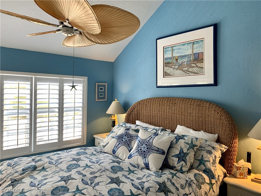 503 Useppa Useppa Island Bokeelia, FL 33922 - Photo 46 of 50 a bed sitting in a bedroom next to a window