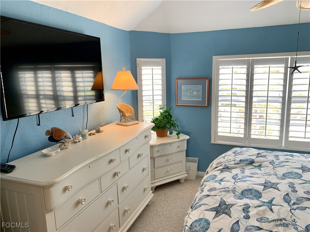 503 Useppa Useppa Island Bokeelia, FL 33922 - Photo 47 of 50 a bedroom with a bed and a window