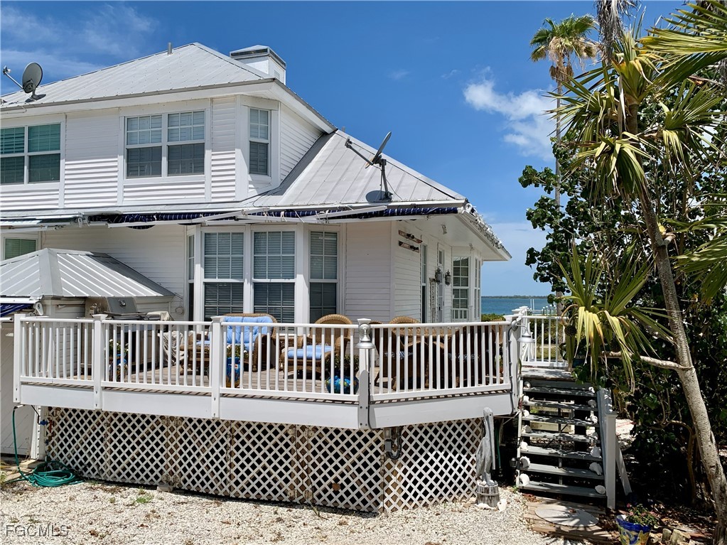 503 Useppa Useppa Island Bokeelia, FL 33922 - Photo 5 of 50 a view of a house with a deck