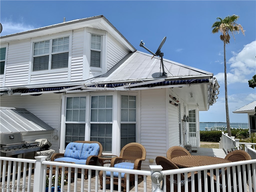 503 Useppa Useppa Island Bokeelia, FL 33922 - Photo 6 of 50 a view of a house with a porch
