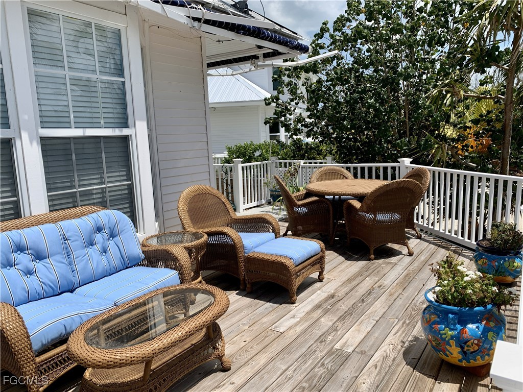 503 Useppa Useppa Island Bokeelia, FL 33922 - Photo 8 of 50 a couple of blue chairs sitting in roof of a house