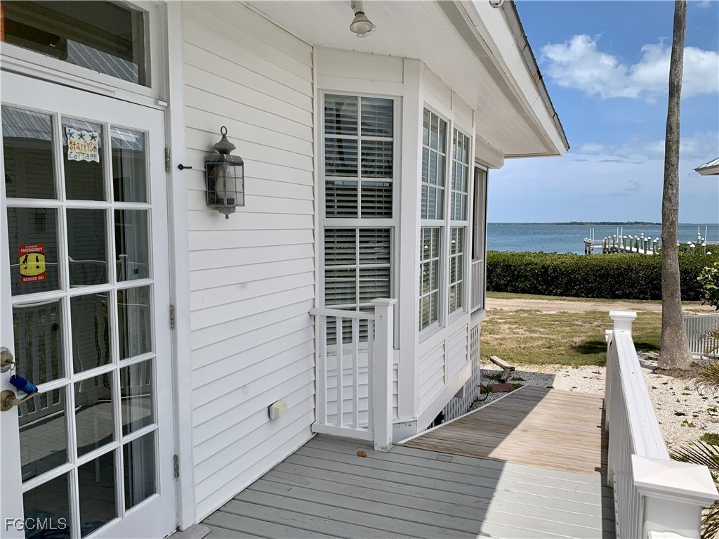 503 Useppa Useppa Island Bokeelia, FL 33922 - Photo 10 of 50 a view of balcony with two chairs and a window