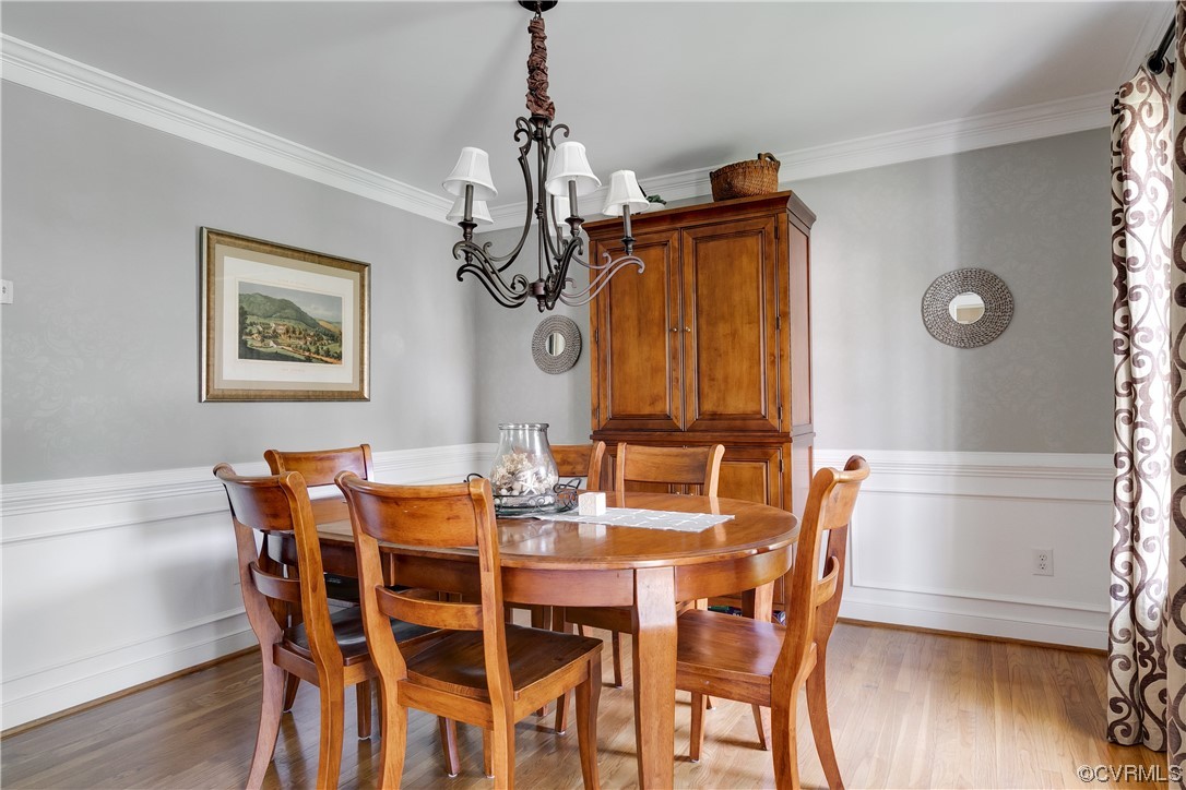 5709 Grove Forest Road Midlothian, VA 23112 - Photo 11 of 39 a view of a dining room with furniture and wooden floor
