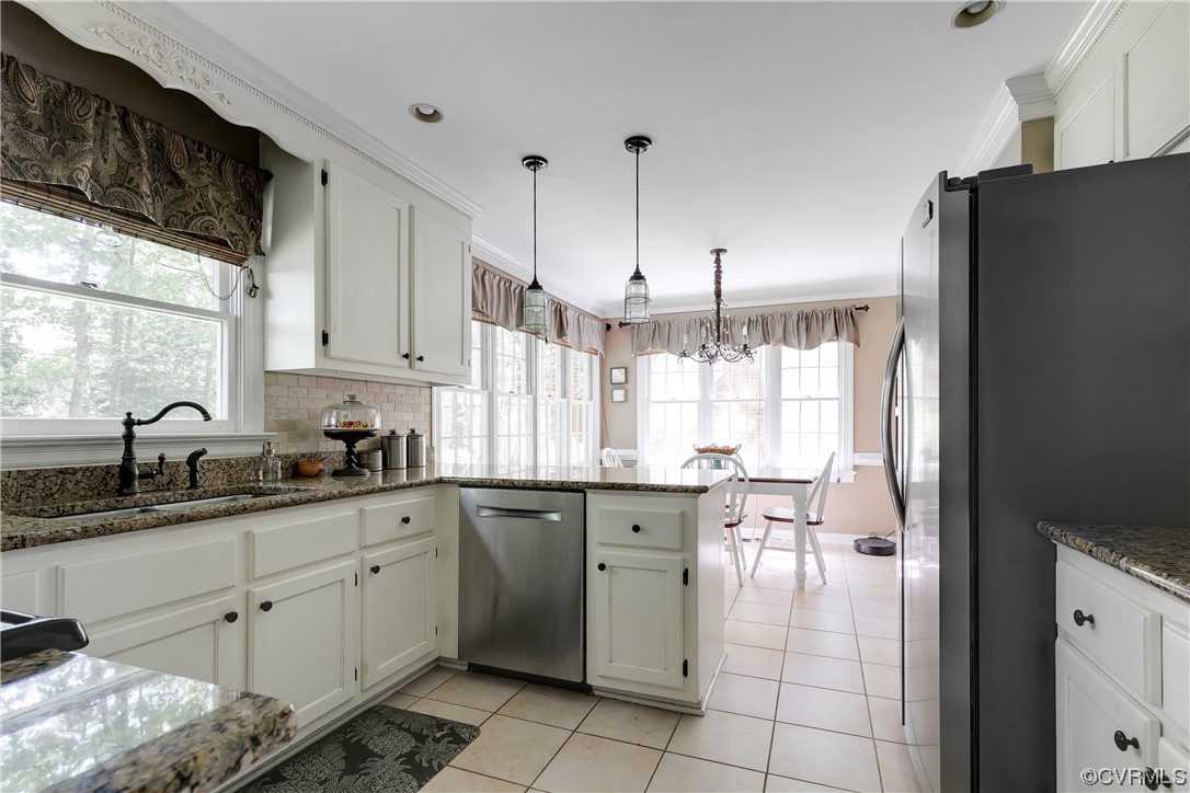 5709 Grove Forest Road Midlothian, VA 23112 - Photo 13 of 39 a kitchen with a sink window and cabinets