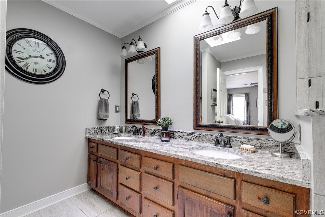 5709 Grove Forest Road Midlothian, VA 23112 - Photo 25 of 39 a bathroom with a double vanity sink and a mirror