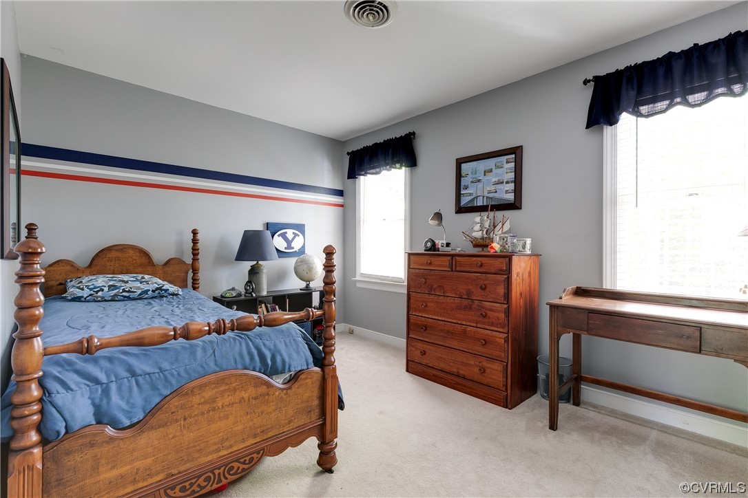 5709 Grove Forest Road Midlothian, VA 23112 - Photo 27 of 39 a bedroom with furniture and wooden floor
