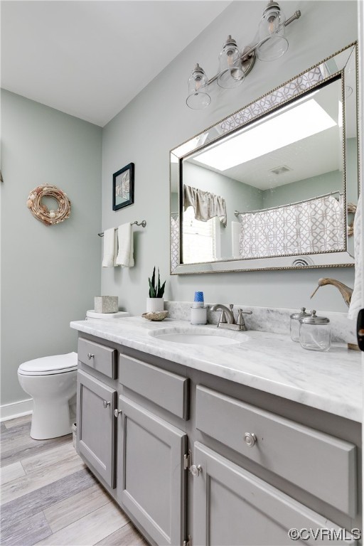 5709 Grove Forest Road Midlothian, VA 23112 - Photo 29 of 39 a bathroom with a granite countertop sink a toilet and mirror