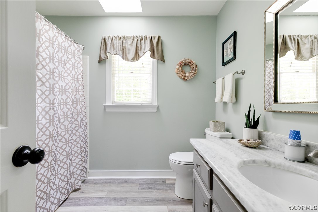 5709 Grove Forest Road Midlothian, VA 23112 - Photo 30 of 39 a bathroom with a sink toilet and shower